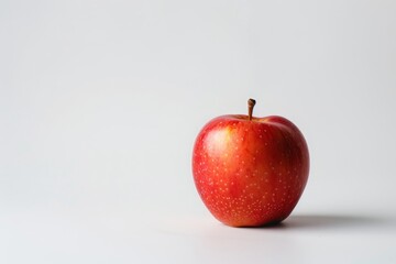 A Single Red Apple on a White Background.