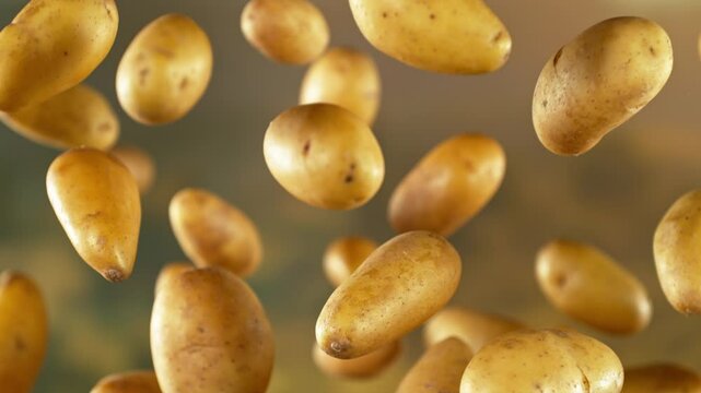 Super slow motion of flying early potatoes with camera movement. Filmed on high speed cinema camera, 1000 fps.
