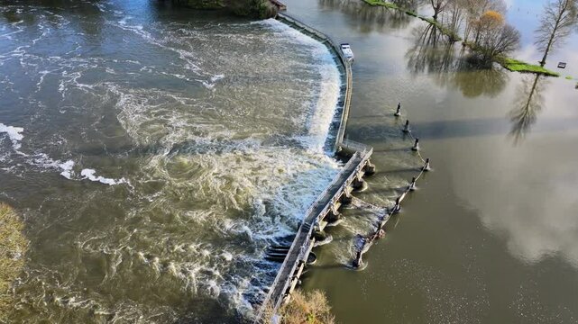 Aerial shot of a wier and cascading water on the River Thames at Hurley
