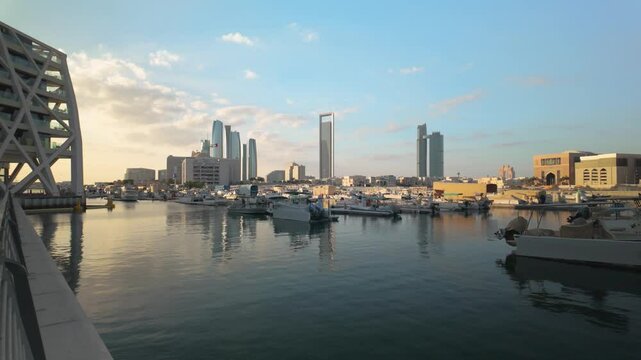 Abu Dhabi Modern Skyline Reflected in Al Bateen Marina. UAE capital city