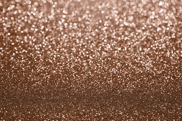 Mocha Mousse, brown sparkling glitter bokeh background, abstract defocused texture. Holiday lights.