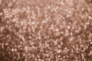 Mocha Mousse, brown sparkling glitter bokeh background, abstract defocused texture. Holiday lights.