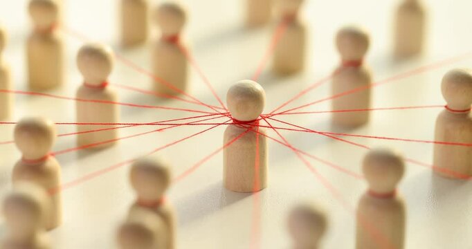 Exploring connections and relationships using wooden figures and installing a red string