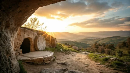 Fototapete Classic religious scene of an empty tomb with a stone rolled away at sunrise in a hillside setting © Tatiana