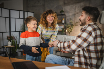 Mum and children surprise dad with gift while he work from home