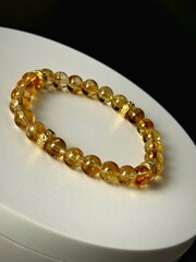 bracelet made of expensive natural stone with silver inserts and a pendant with runes