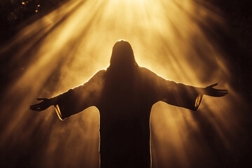 jesus christ with arms out embracing the light from above