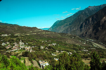 Sichuan, China Jiaju Tibetan Village, Danba, concentrated place for Jiarong Tibetans with hundreds of Tibetan-style houses built along the mountains fertile fields, picturesque landscapes