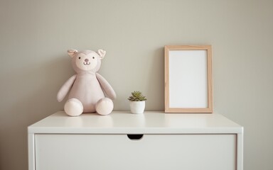 A minimalistic shelf showcases a soft teddy bear and a small potted plant beside an empty framed artwork