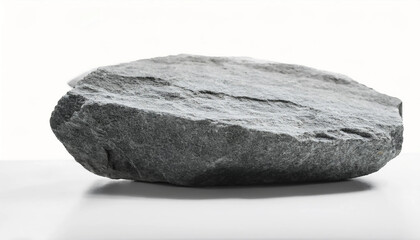 Fototapeta premium A detailed view of a large, natural gray rock resting isolated on a clean white background, showcasing rough texture and natural form.