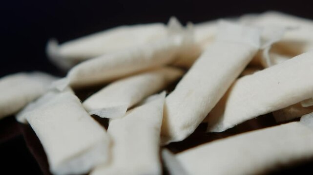 Snus nicotine tobacco close up, pack of tobacco for gum. unhealthy addiction. Man opening box with snus and taking one. 