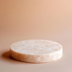 Minimalist beige round marble platform on neutral background
