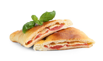 Pieces of tasty vegetarian calzone with tomato, cheese and basil isolated on white