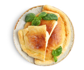 Pieces of delicious calzone pizza with mozzarella, tomatoes and basil isolated on white, top view