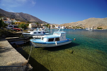 clear water in the harbour of Pedi , Symi island