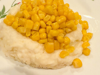 Canned Corn Scooped On Top Of Mashed Potatoes As Kids Do