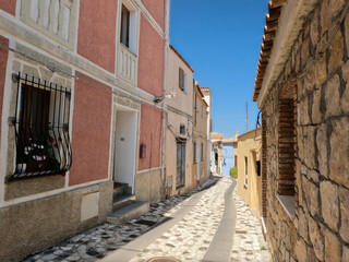 Typical street in Pratto, Sardinia. Deserted in the heat of the afternoon.