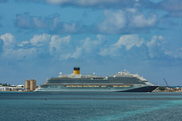 Modern mega family cruiseship cruise ship liner Firenze docked at pier near Hamilton, Bermuda on...