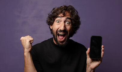 young bearded crazy man with a smartphone