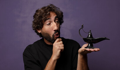 young bearded crazy man  with a genious lamp