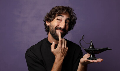 young bearded crazy man  with a genious lamp