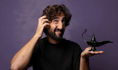 young bearded crazy man  with a genious lamp