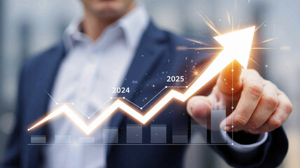 Business man pointing to arrow up chart representing the economic growth in the year 2025