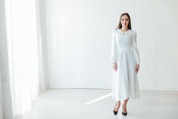 Beautiful slender woman in white wedding dress