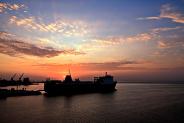 Obraz premium Sunset. Sunrise. Night views of ships and berths in the port. 2024.