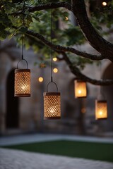 Always loved and remembered. Charming lanterns hanging from a tree in a serene outdoor space.