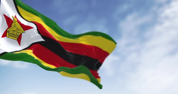 Close-up view of the Zimbabwe national flag waving in the wind