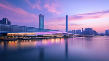 Fototapeta premium A modern skyline at sunset reflecting on water, showcasing urban architecture and tranquility.