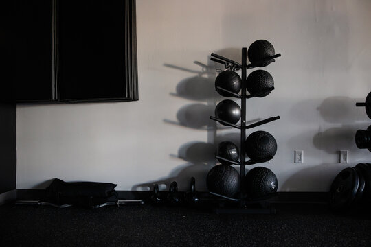Minimalist Gym Interior Featuring Workout Equipment and Shadow Play