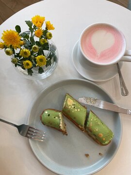 Breakfast in the cafe with eclair and matcha