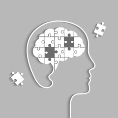 Head silhouette with brain made of jigsaw puzzle but missing pieces concept