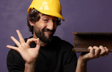 young bearded crazy worker man with helmet