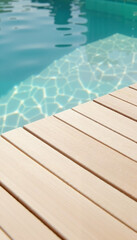 Sleek wooden deck edge beside a shimmering swimming pool with turquoise water
