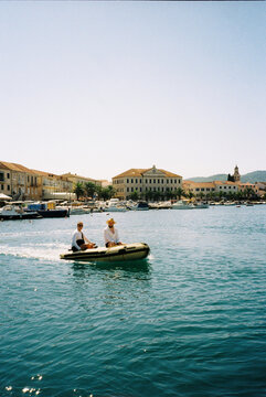 Men are sailing in a motor boat