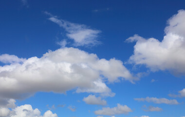 Obraz premium natural backdrop with white clouds and blue sky ideal as background for weather forecast or nature concept