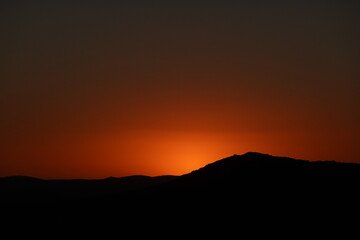 Orange sunset in the mountains