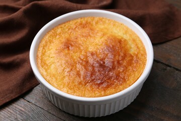 Tasty semolina cake served on wooden table, closeup
