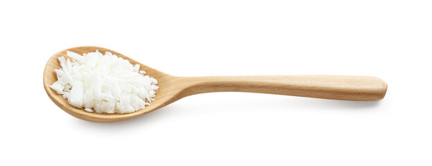 Soy wax in wooden spoon isolated on white