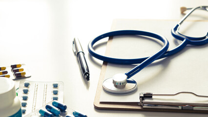 Stethoscope on white background, top view