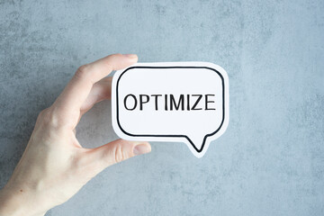 Optimize text on paper on card in hand.