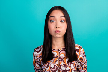 Fototapeta premium Portrait of nice young girl hold breath empty space wear top isolated on turquoise color background