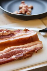 Close-up of bacon during the preparation, cutting and cooking process