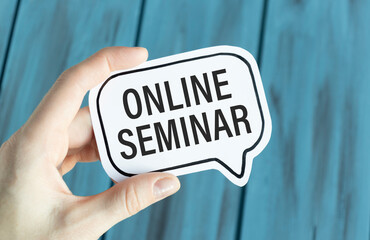 Man holding brochure with ONLINE SEMINAR text on grey background. Mock up for design