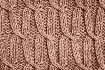 Knitted fabric wool texture close up as a background. Color of the year 2025 inspired