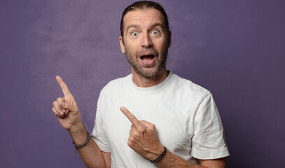 feeling happy, excited and surprised, looking to the side with both hands on face