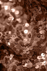 Abstract composition of fabric with shiny sequins. Holiday and party concept. Color of the year 2025 inspired